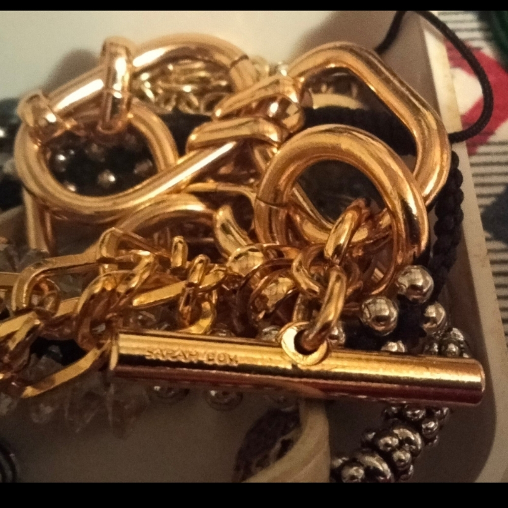 Lot of bracelets,  smart watches and earrings .